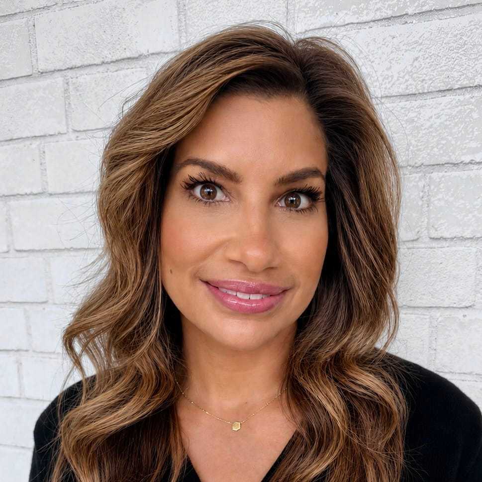 Portrait of Jenn, a professional stylist at Hudson Salon, showcasing their expertise and style.