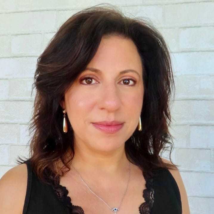 Portrait of Jennifer, a professional stylist at Hudson Salon, showcasing their expertise and style.