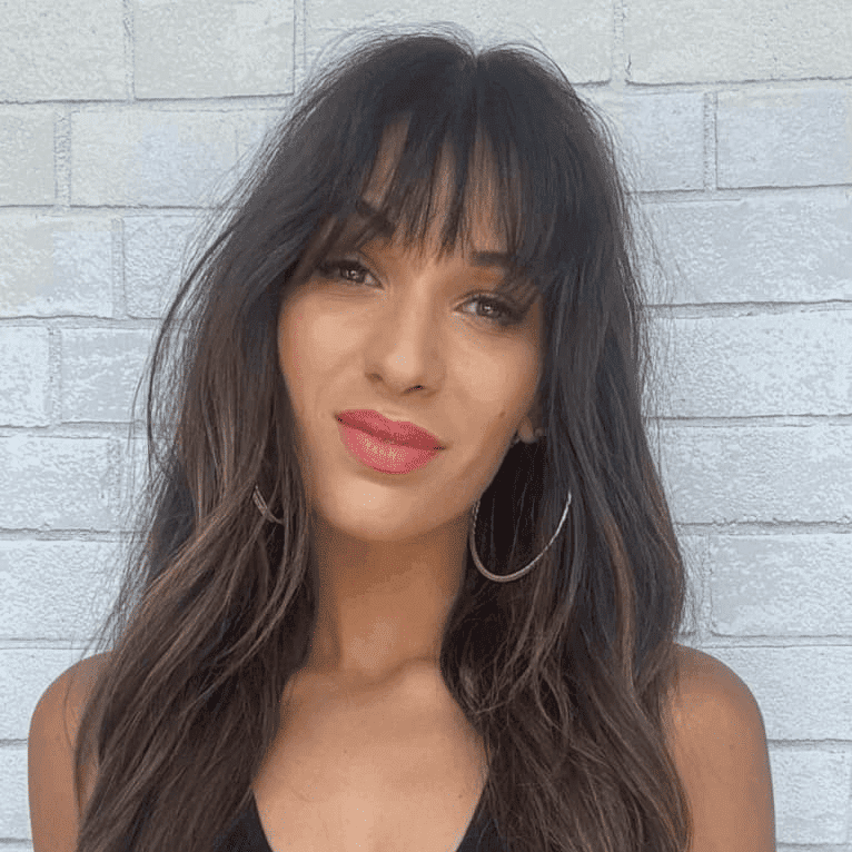 Portrait of Marian, a professional stylist at Hudson Salon, showcasing their expertise and style.