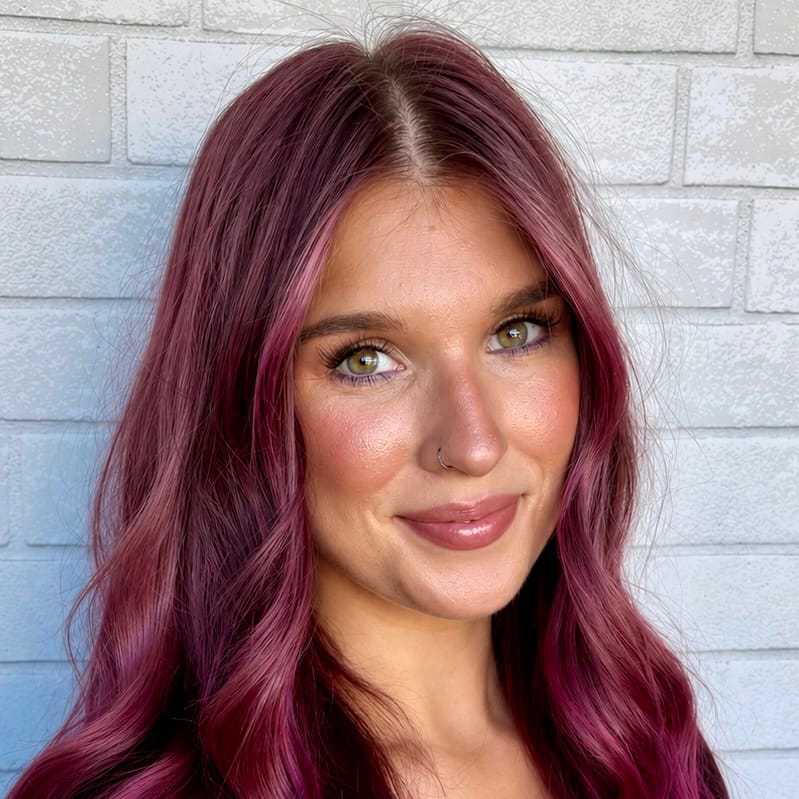 Portrait of Jessie, a professional stylist at Hudson Salon, showcasing their expertise and style.