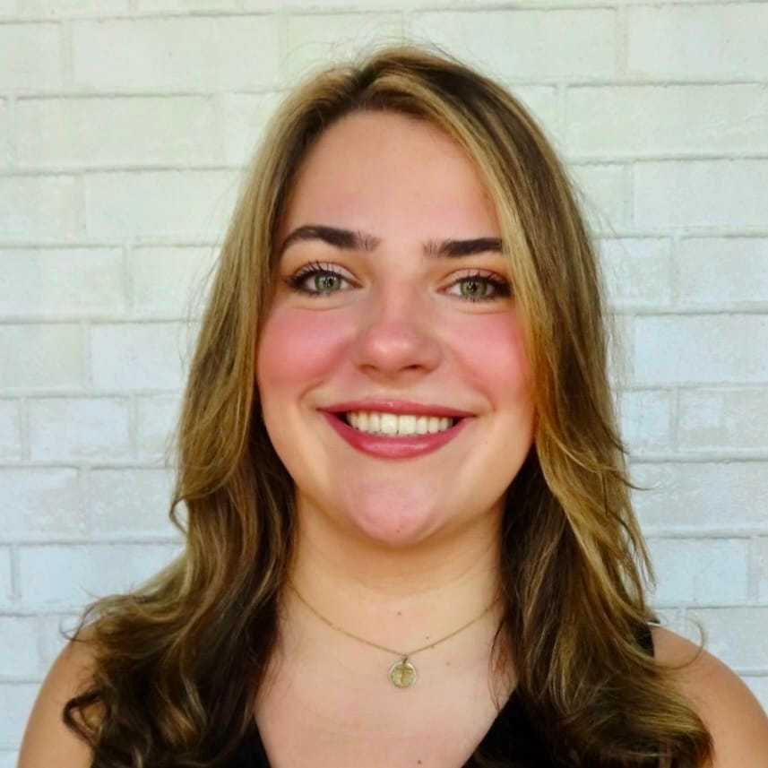 Portrait of Emily, a professional stylist at Hudson Salon, showcasing their expertise and style.