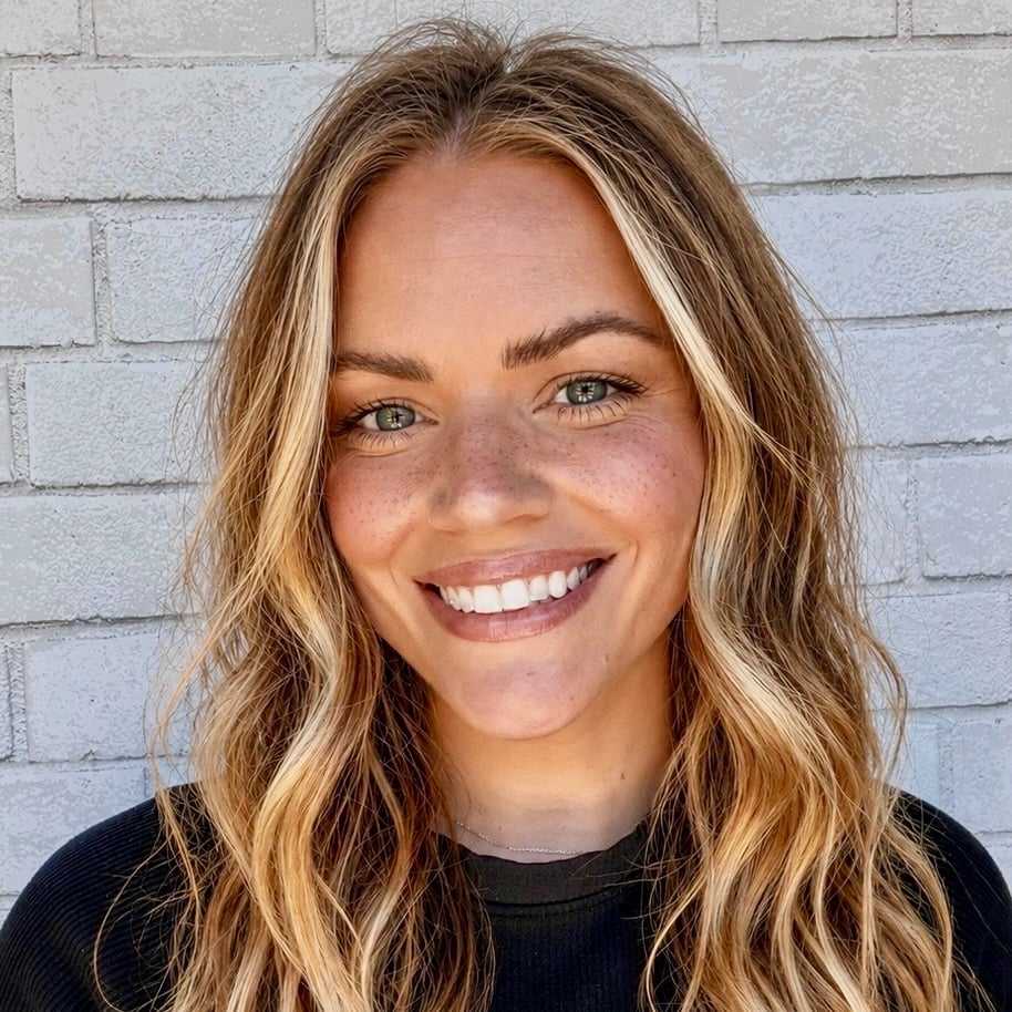 Portrait of Maggie, a professional stylist at Hudson Salon, showcasing their expertise and style.