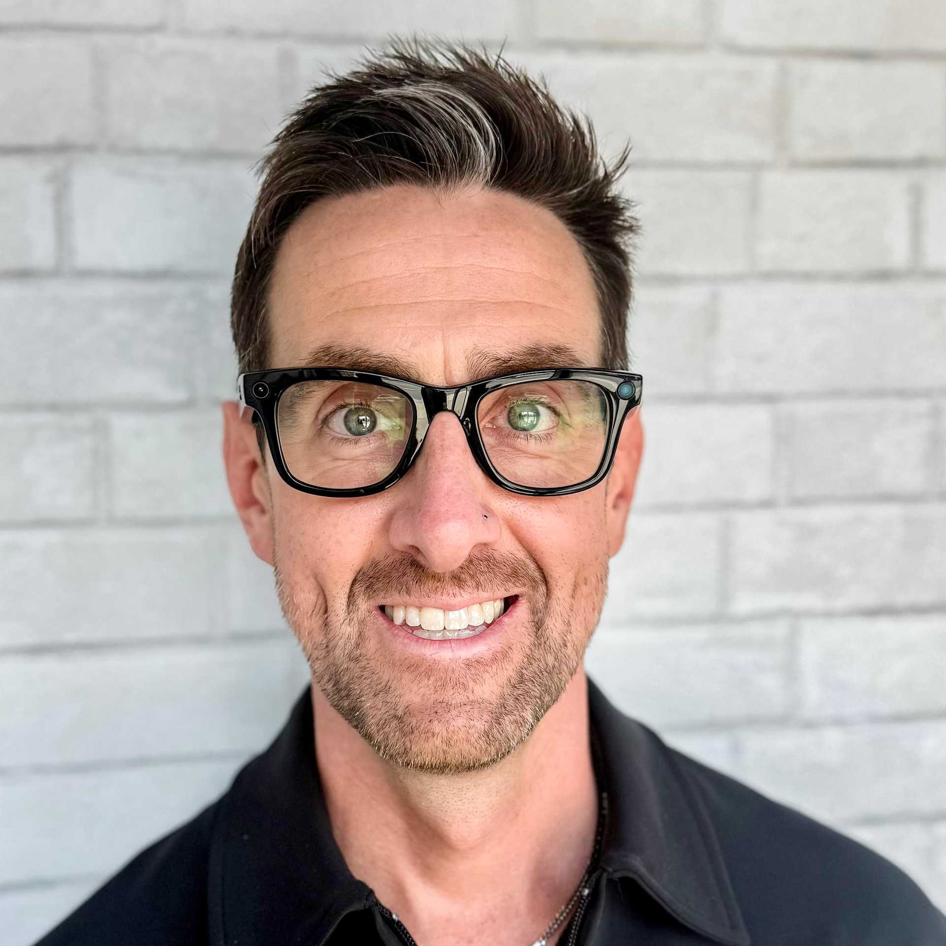 Portrait of Hudson, a professional stylist at Hudson Salon, showcasing their expertise and style.