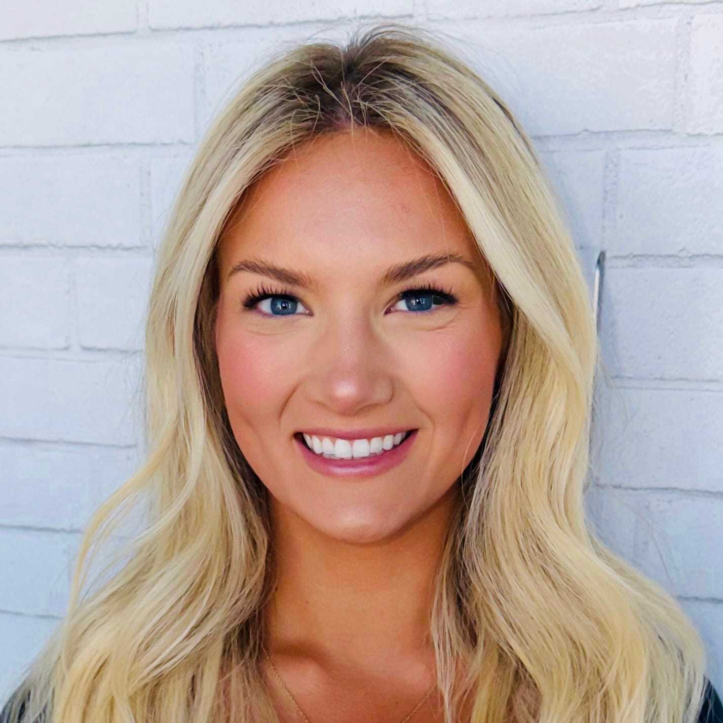 Portrait of Julia, a professional stylist at Hudson Salon, showcasing their expertise and style.