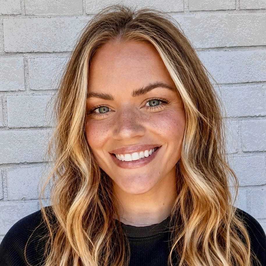 Portrait of Maggie, a professional stylist at Hudson Salon, showcasing their expertise and style.