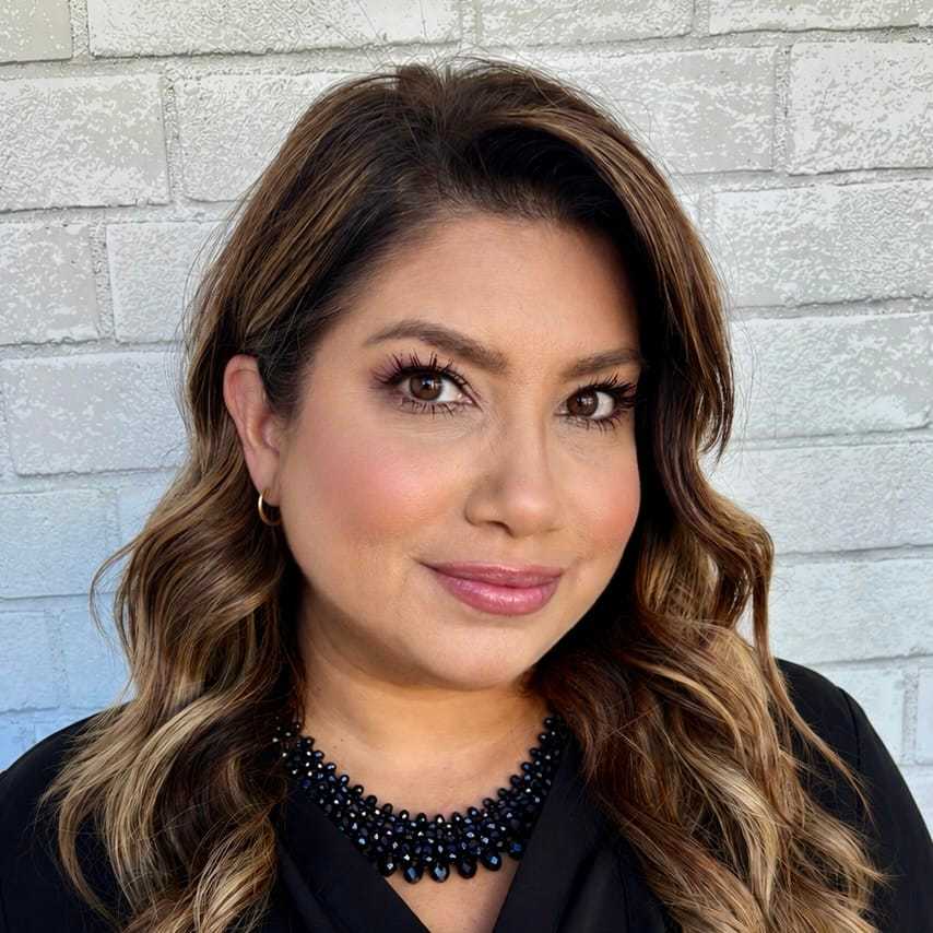 Portrait of Jackie, a professional stylist at Hudson Salon, showcasing their expertise and style.