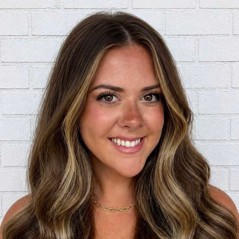 Portrait of Elizabeth Anne, a professional stylist at Hudson Salon, showcasing their expertise and style.