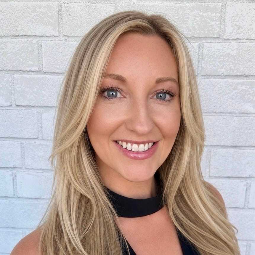 Portrait of Liz, a professional stylist at Hudson Salon, showcasing their expertise and style.