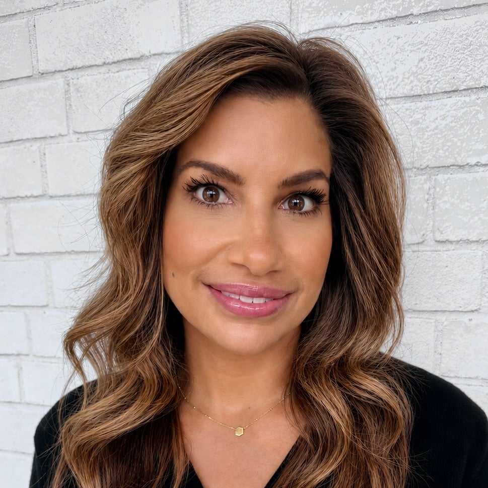 Portrait of Jenn, a professional stylist at Hudson Salon, showcasing their expertise and style.