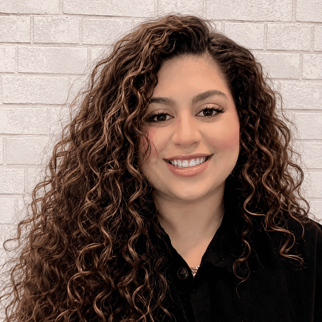 Portrait of Kandy, a professional stylist at Hudson Salon, showcasing their expertise and style.
